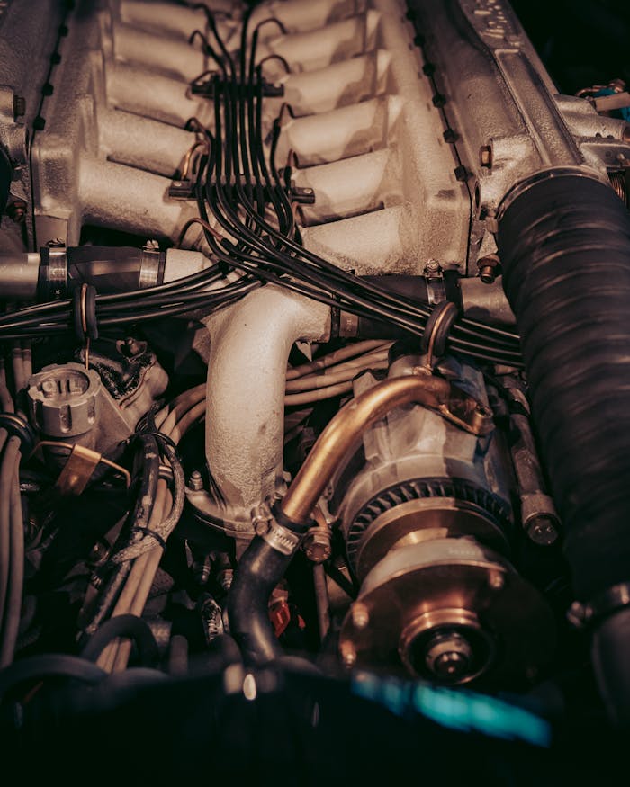 High-resolution image showcasing a complex car engine with intricate wiring and components.